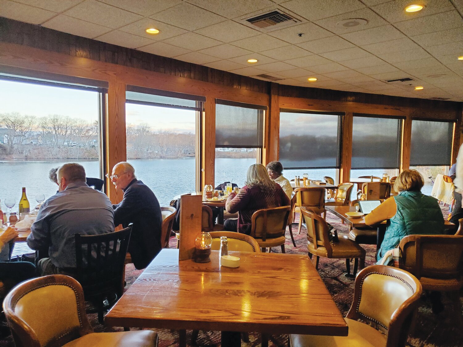 THE BACKROOM: An early dinner crowd in one of Twin Oaks’ most scenic dining rooms where the bartender is ready to serve Ferro’s favorite wine or Regine’s martini.
